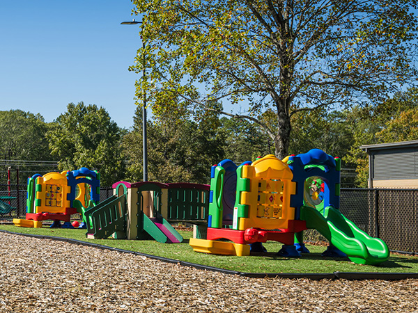SR Carolinas toddler playground systems with slides and activity panels at park in The Carolinas