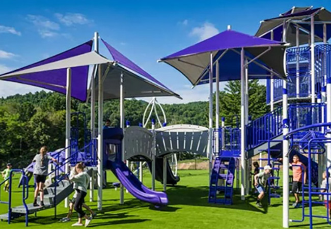 Children playing on Superior Recreational Products playground with integrated shade canopies in Burlington, North Carolina.