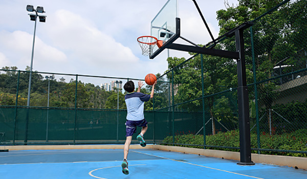 ADA rubber playground surface mats installed under swing paths for extra safety and accessibility.