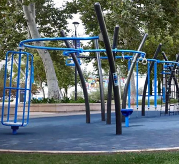 Outdoor blue fitness-style playground climber with monkey bars by Superior Recreation of the Carolinas.