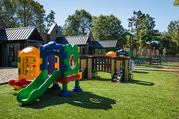 SR Carolinas colorful preschool playground equipment with slides and climbing structures in The Carolinas