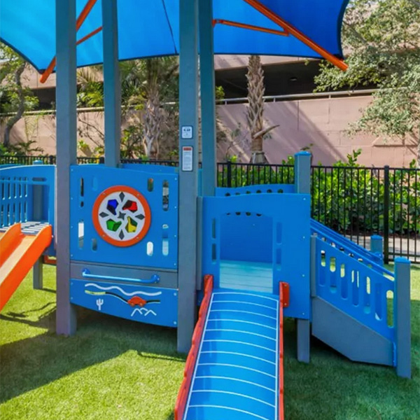 ADA-compliant preschool playground with ramps, slides, and shade canopy by Superior Recreation of the Carolinas in South Carolina.