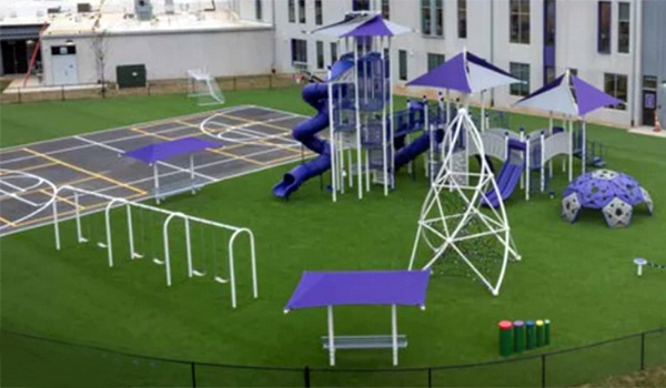 Superior Recreation of the Carolinas modern school playground with climbing nets, shade canopies, and turf surfacing in North Carolina.